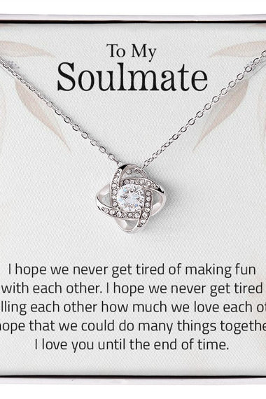 Lifestyle Gear, LLC's Love Knot Necklace - A symbol of unbreakable love featuring a beautiful pendant with cubic zirconia crystals. Available in 14k white gold or 18k yellow gold over stainless steel, with an adjustable chain and lobster clasp for a perfect fit.